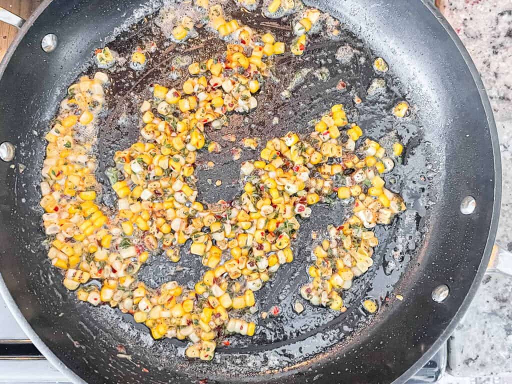 This is a picture of corn cooking with spices. 