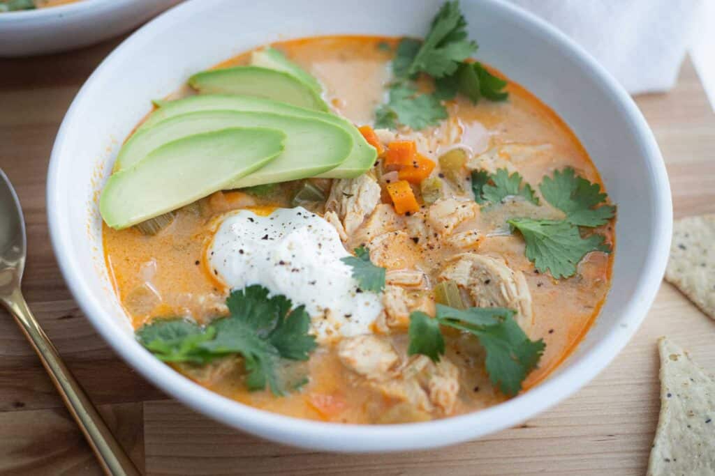 This is a picture of one-pot buffalo chicken chili in a bowl. 