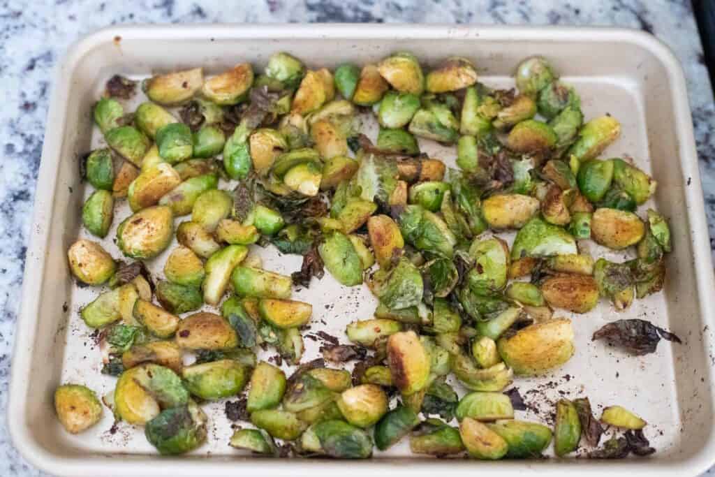 This is a picture of brussels sprouts on a sheet pan. The Hangry Economist.
