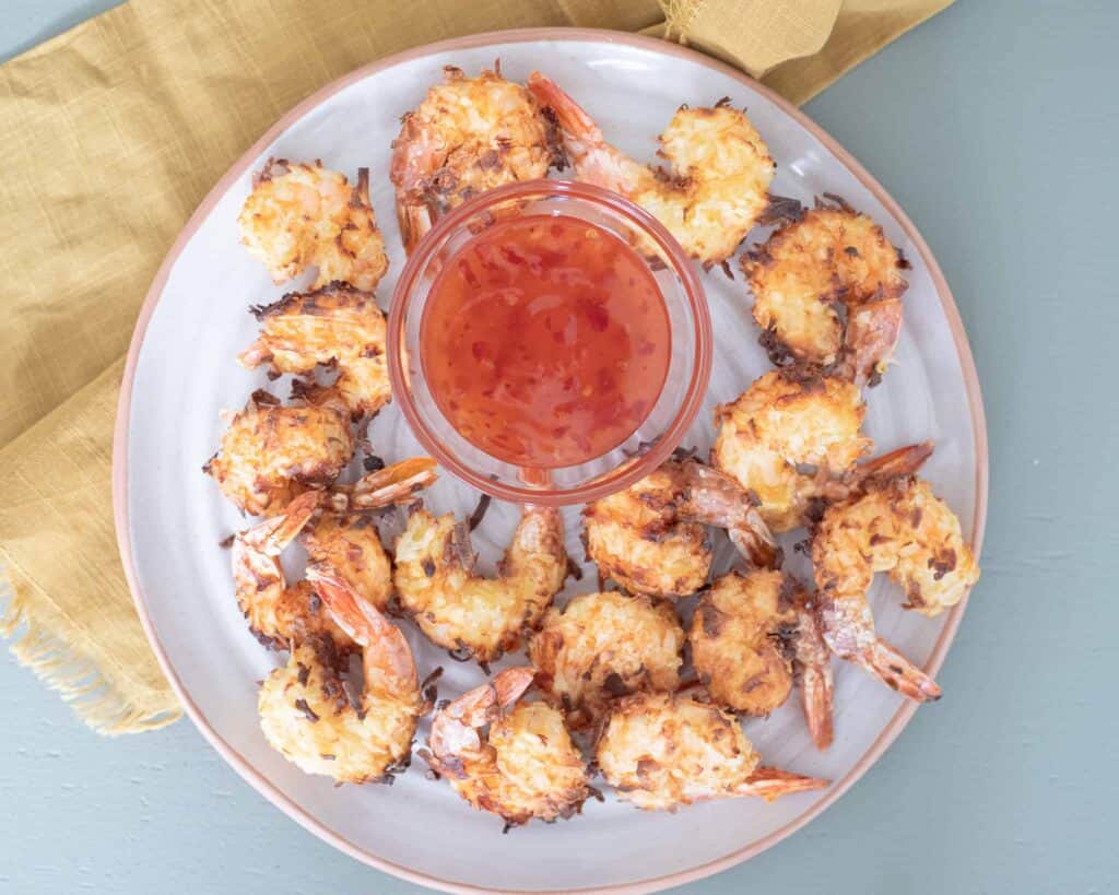 This is a plate of coconut shrimp with dipping sauce. The Hangry Economist.