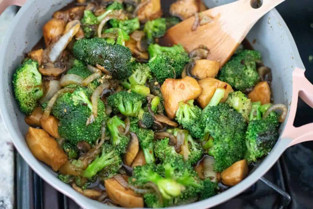 This is a picture of chicken and broccoli cooking in a pan. The Hangry Economist.