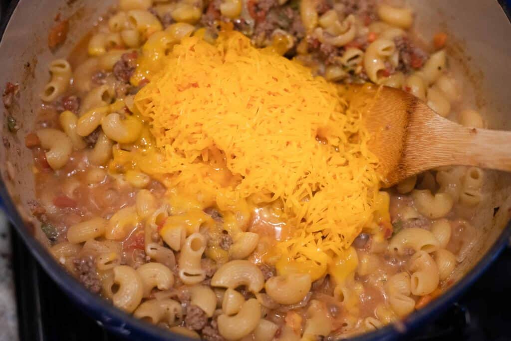 This is a picture of cheese melting into pasta in a dutch oven. The Hangry Economist.
