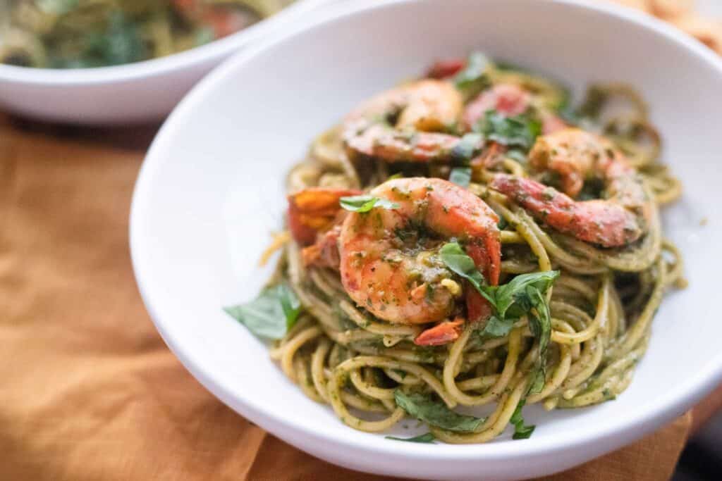 This is a picture of a bowl of shrimp and pesto pasta. The Hangry Economist.