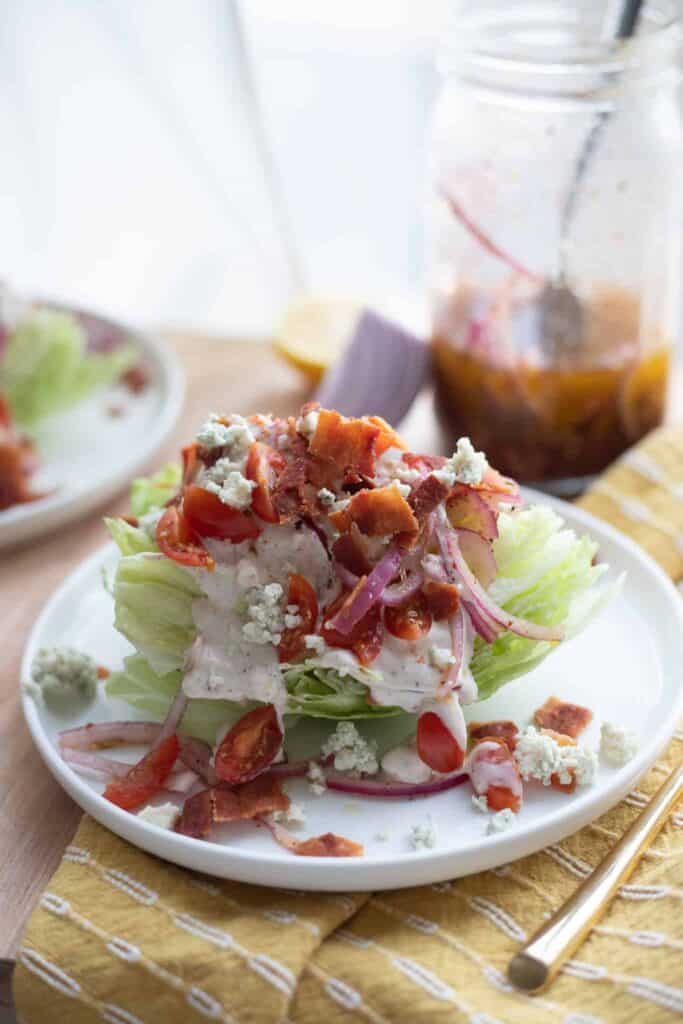 This is a picture of a wedge salad on a plate. The Hangry Economist.