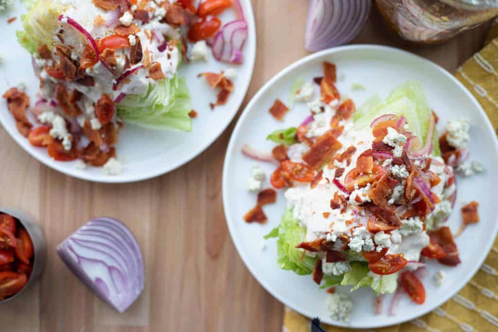 This is a picture of two wedge salads on a plate. The Hangry Economist.