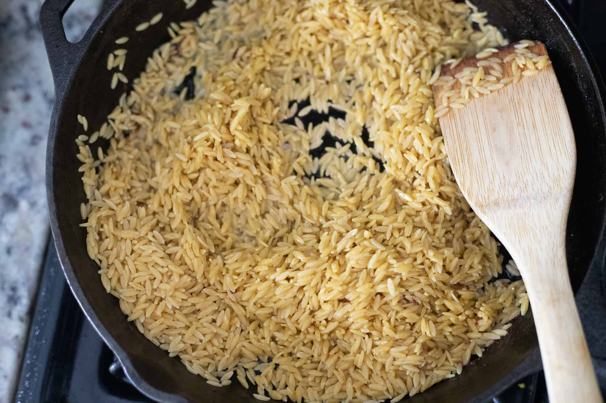 Orzo cooking in a pan. The Hangry Economist.