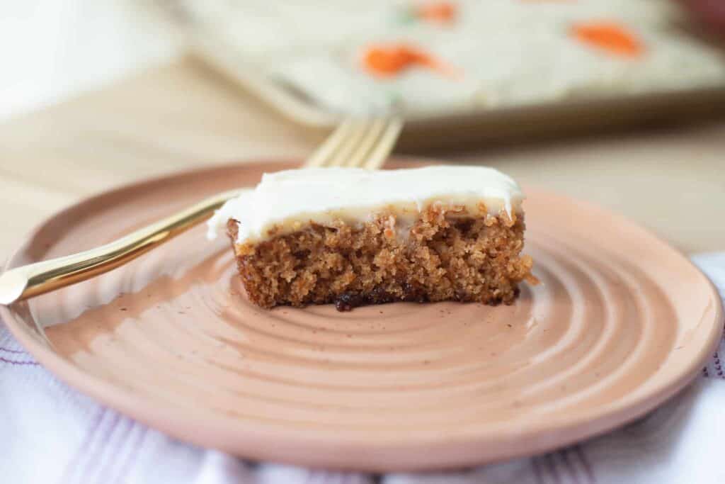 This is a picture of a carrot cake bar on a plate. The Hangry Economist.
