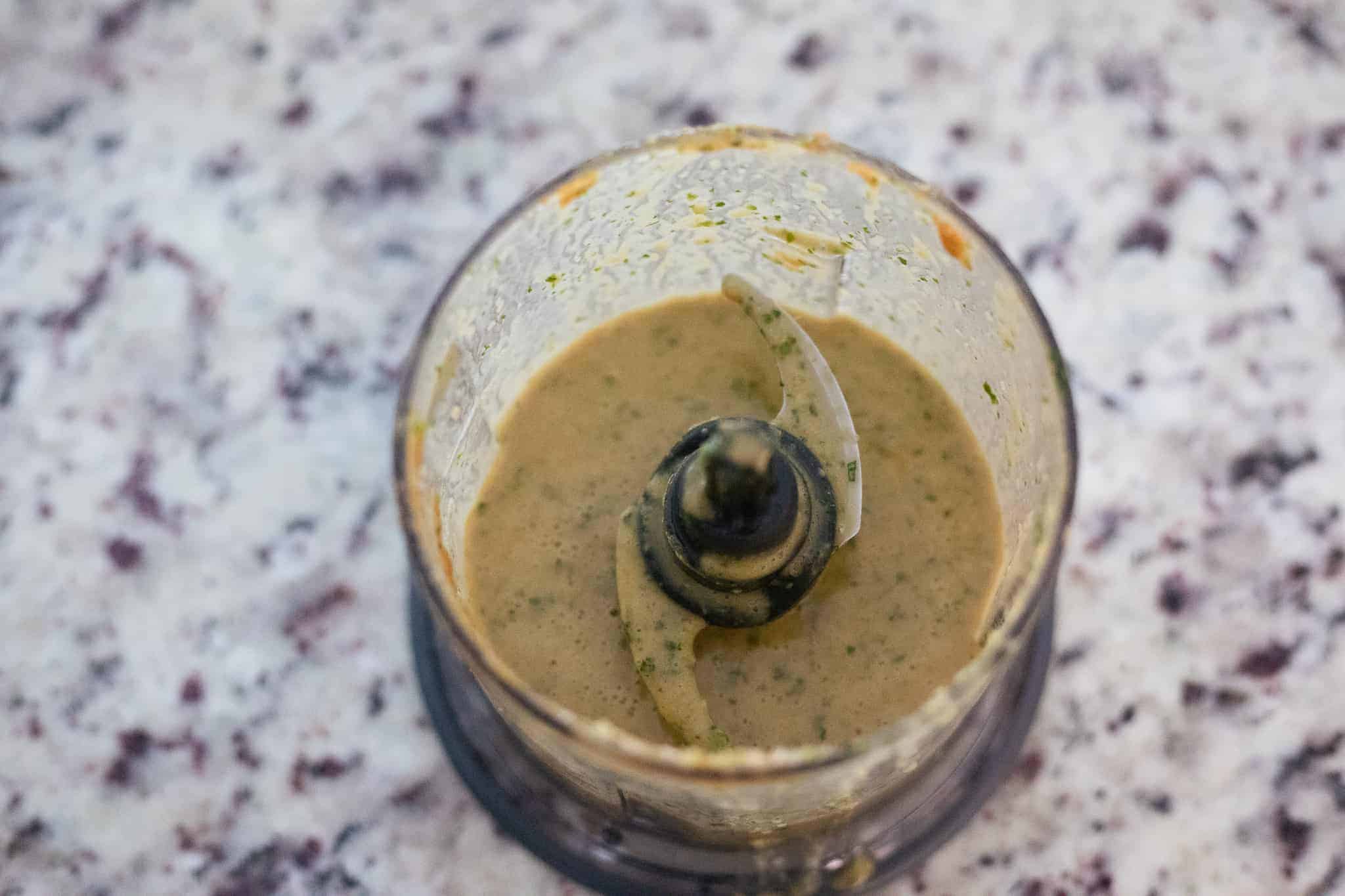 Salad dressing in a food processor. The Hangry Economist.