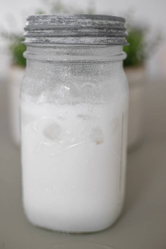 Coconut water mocktail in a quart-sized mason jar.