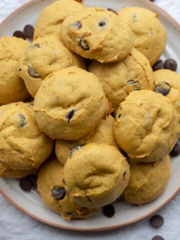 A plate full of pumpkin chocolate chip cookies.