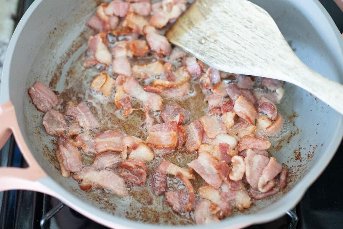 Bacon cooking in a pan. 