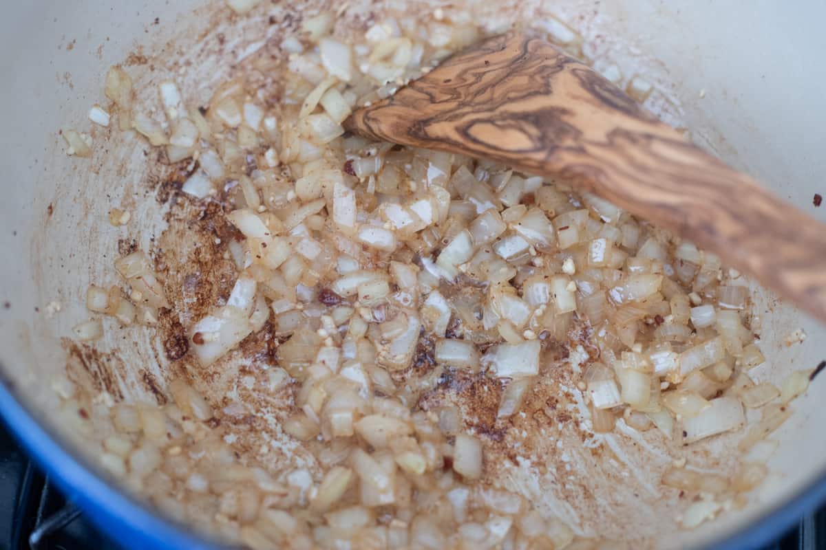 Onions cooking in a dutch oven. 