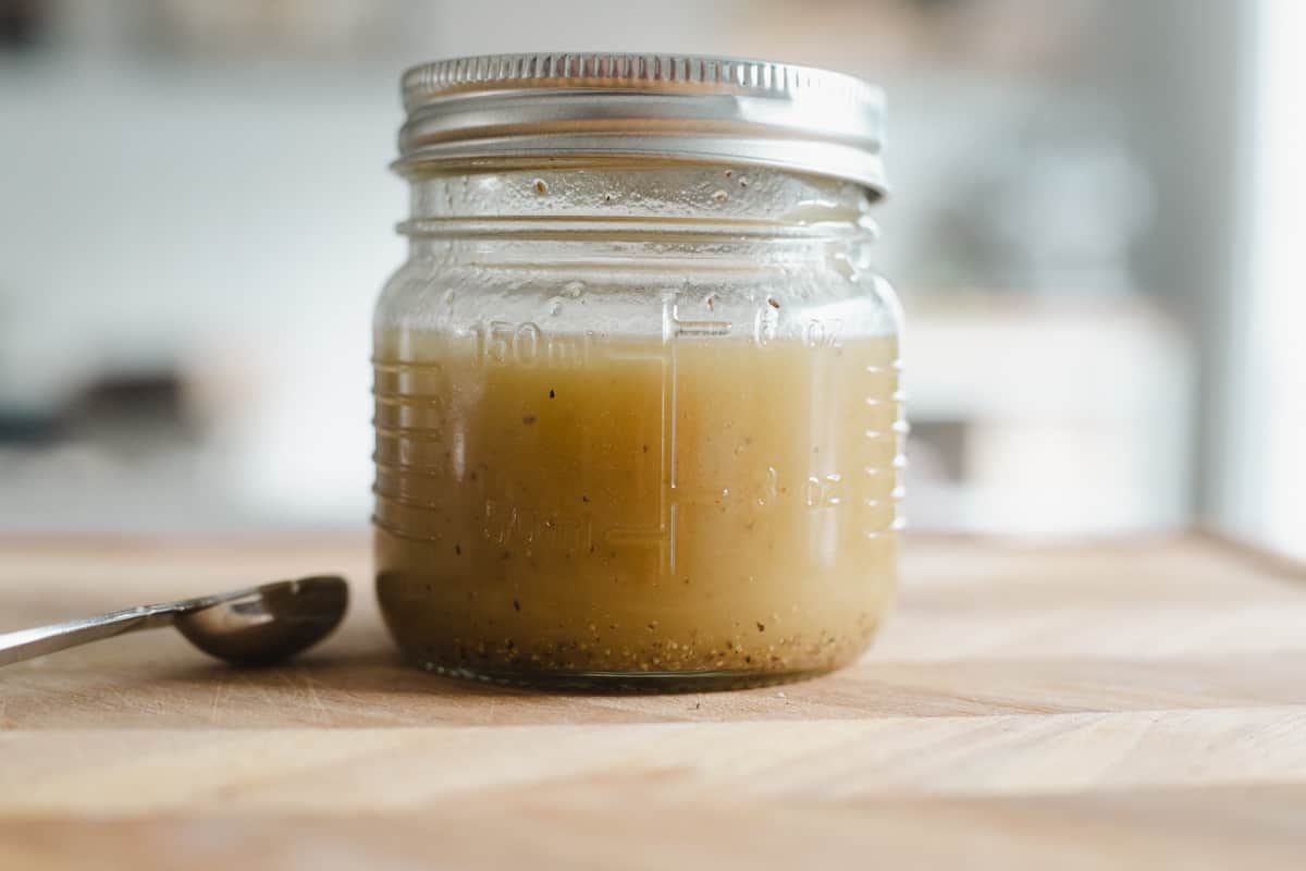 Oil and vinegar mixed together in a jar. 