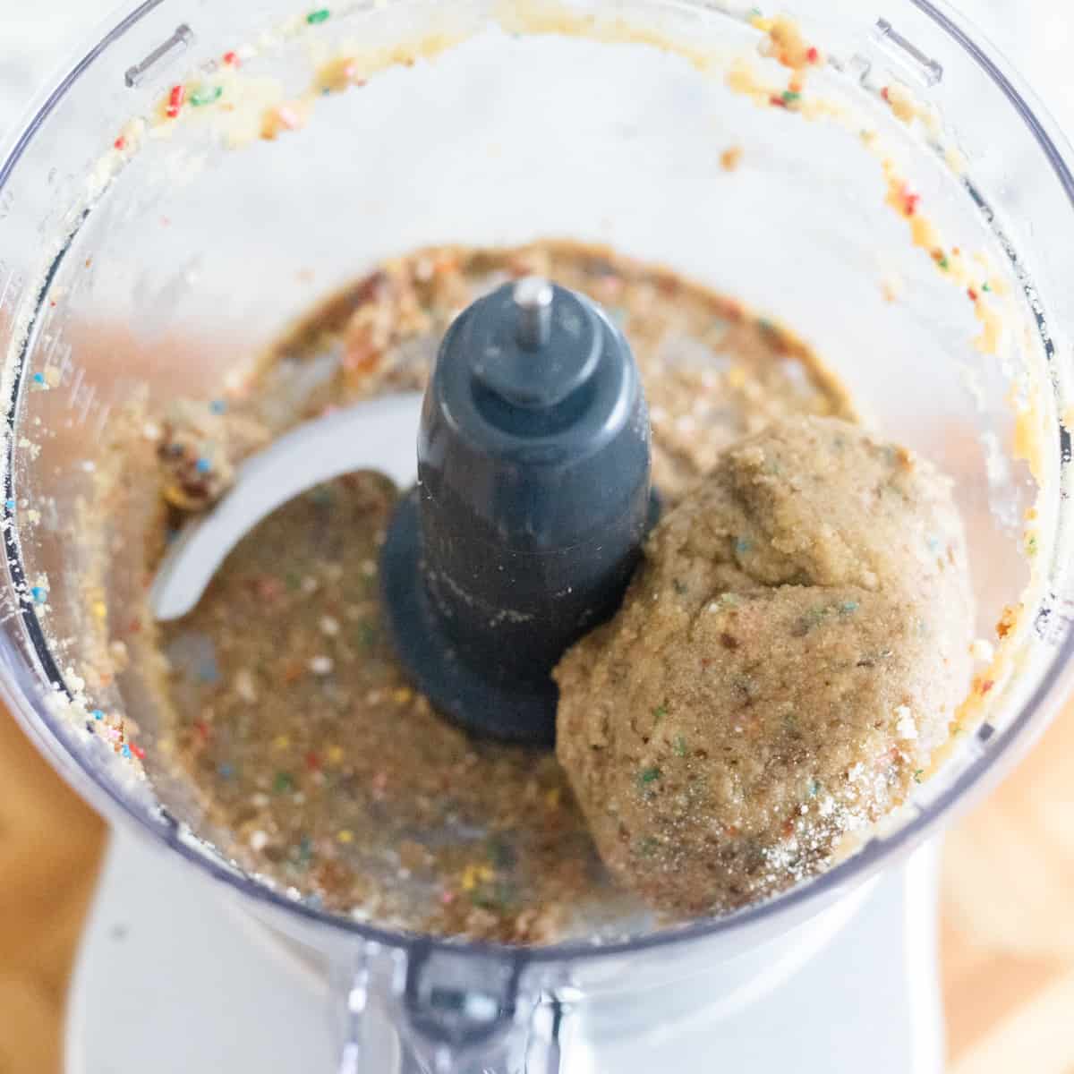 Edible sugar cookie dough mixed up in a food processor. 