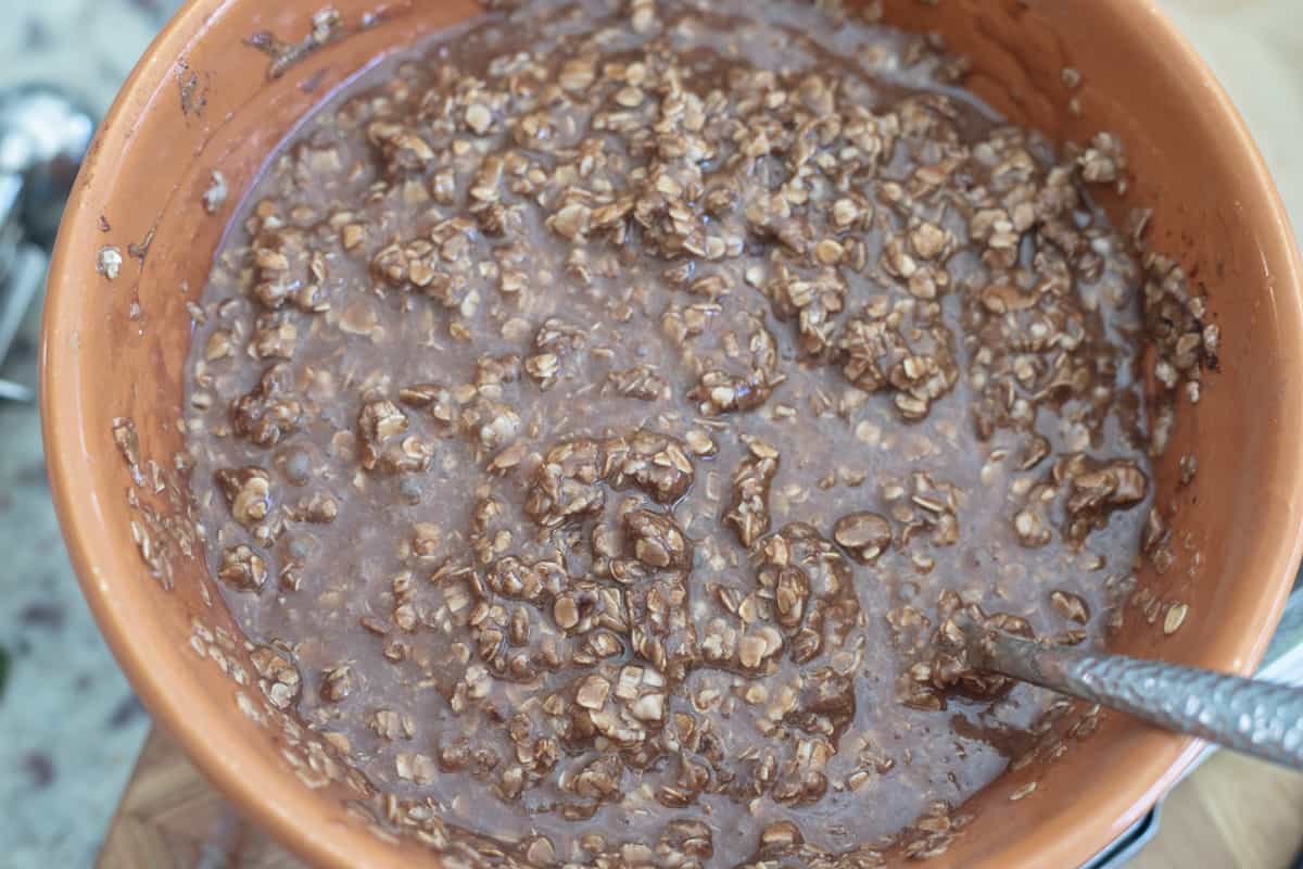 No-bake cookie ingredients mixed together in a mixing bowl. 