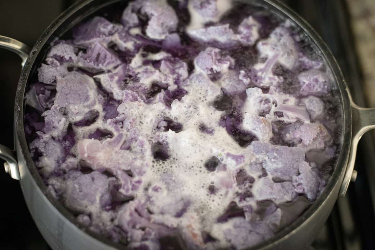 Cooked purple cauliflower in a pan. 