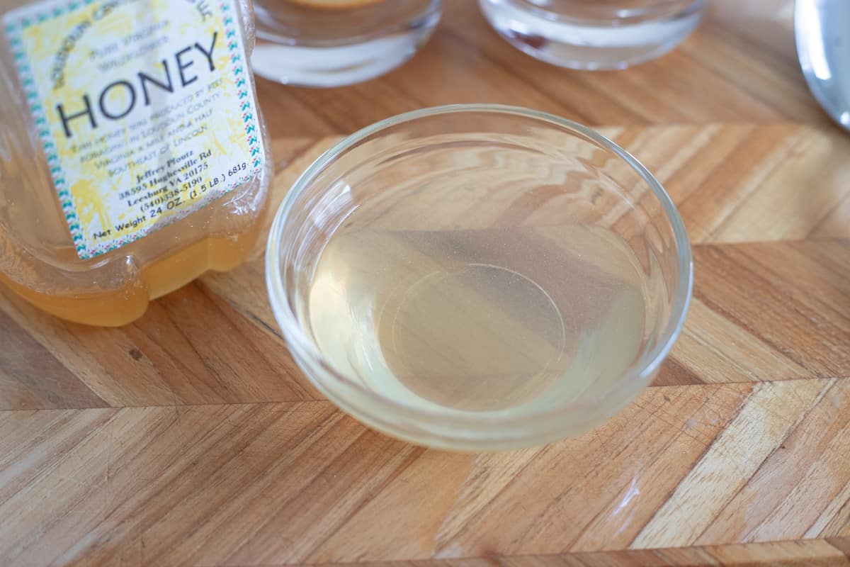 Honey dissolved in water in a glass bowl. 