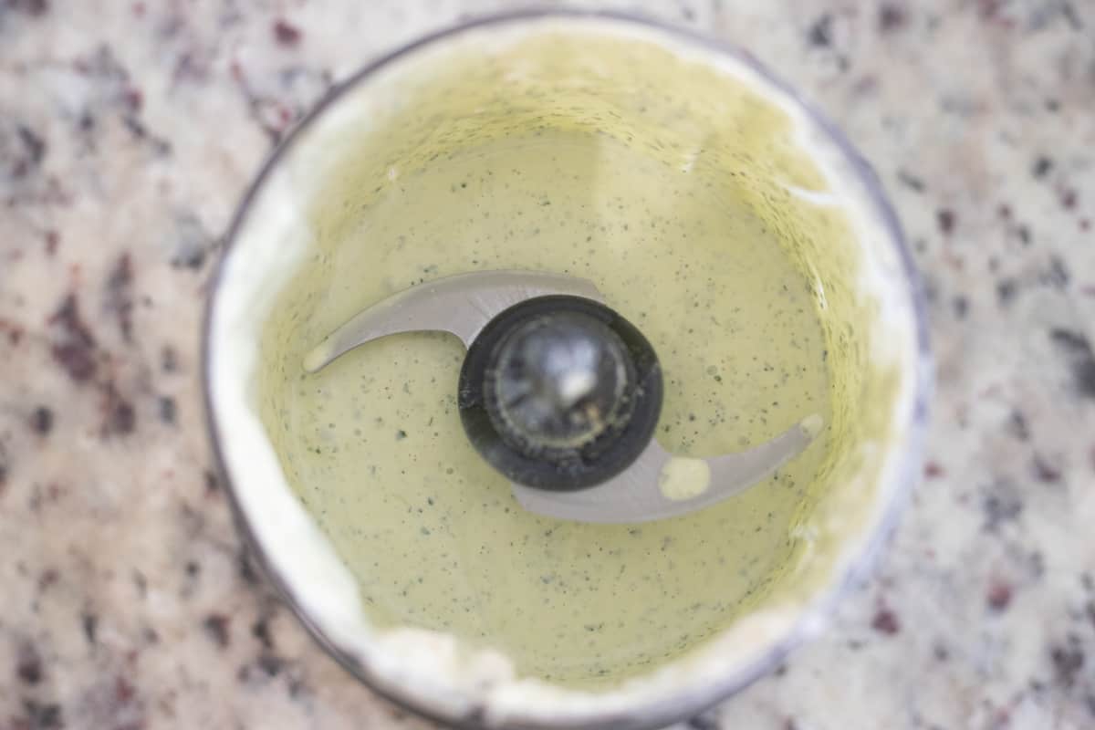 Blended cilantro ranch in a food processor. It's smooth and the cilantro is chopped finely. 