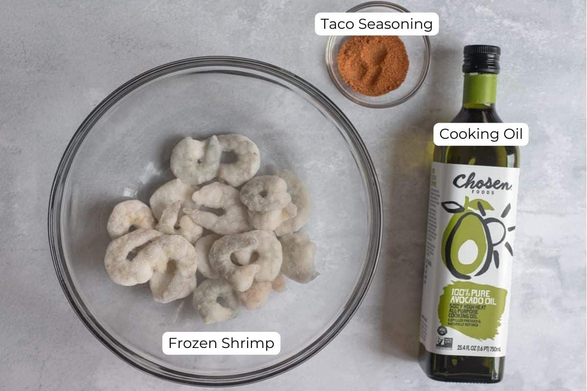 Ingredients for air fryer frozen shrimp on a countertop. 