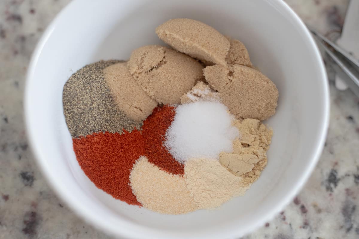 BBQ rub ingredients in a small white bowl. 