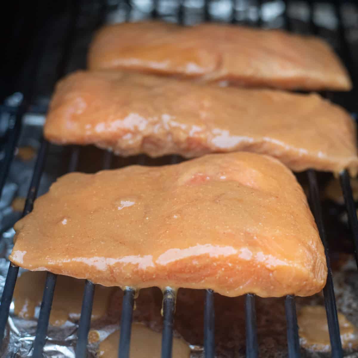 Salmon fillets on a grill. 