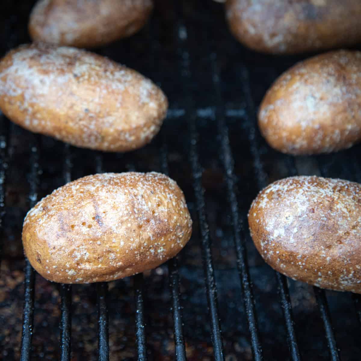 Baked potatoes on a Traeger grill.