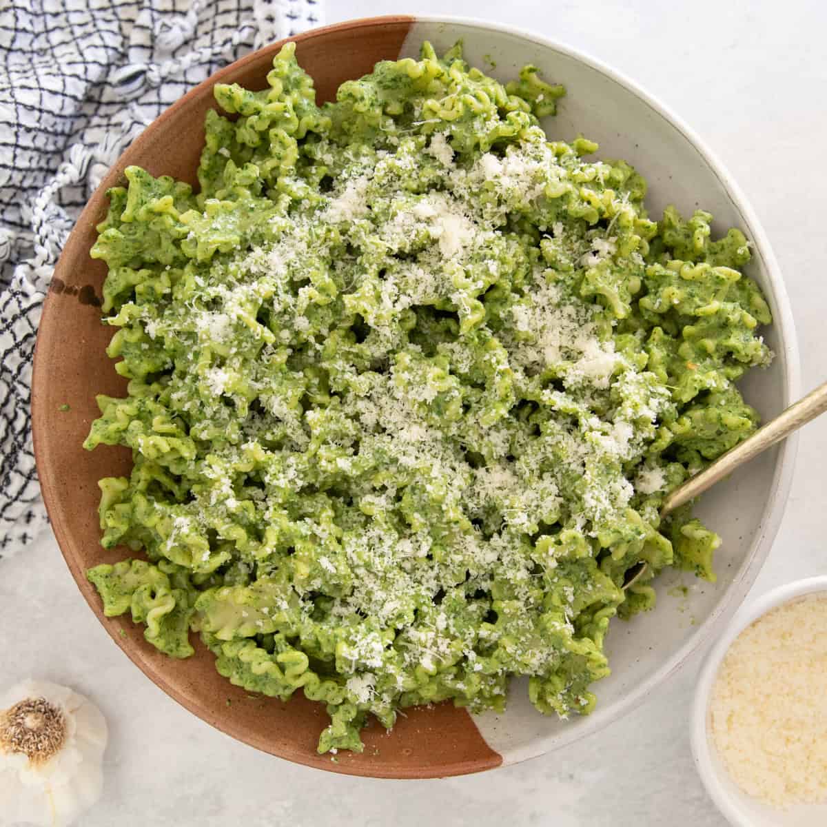 Pesto Ricotta Pasta in a bowl on a white countertop