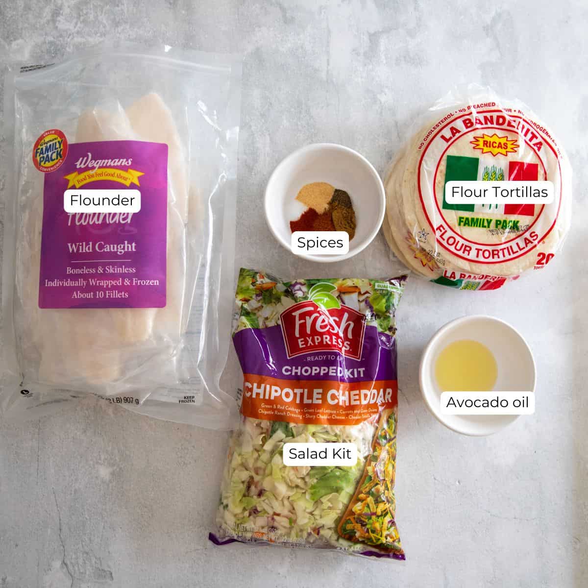 Ingredients needed for flounder tacos laid out on a countertop.