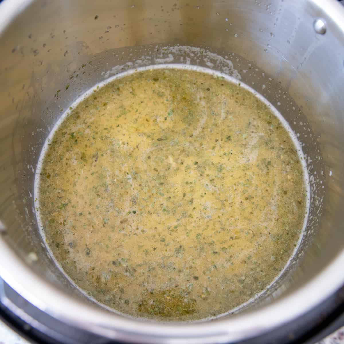 Uncooked ingredients in liquid in an instant pot.